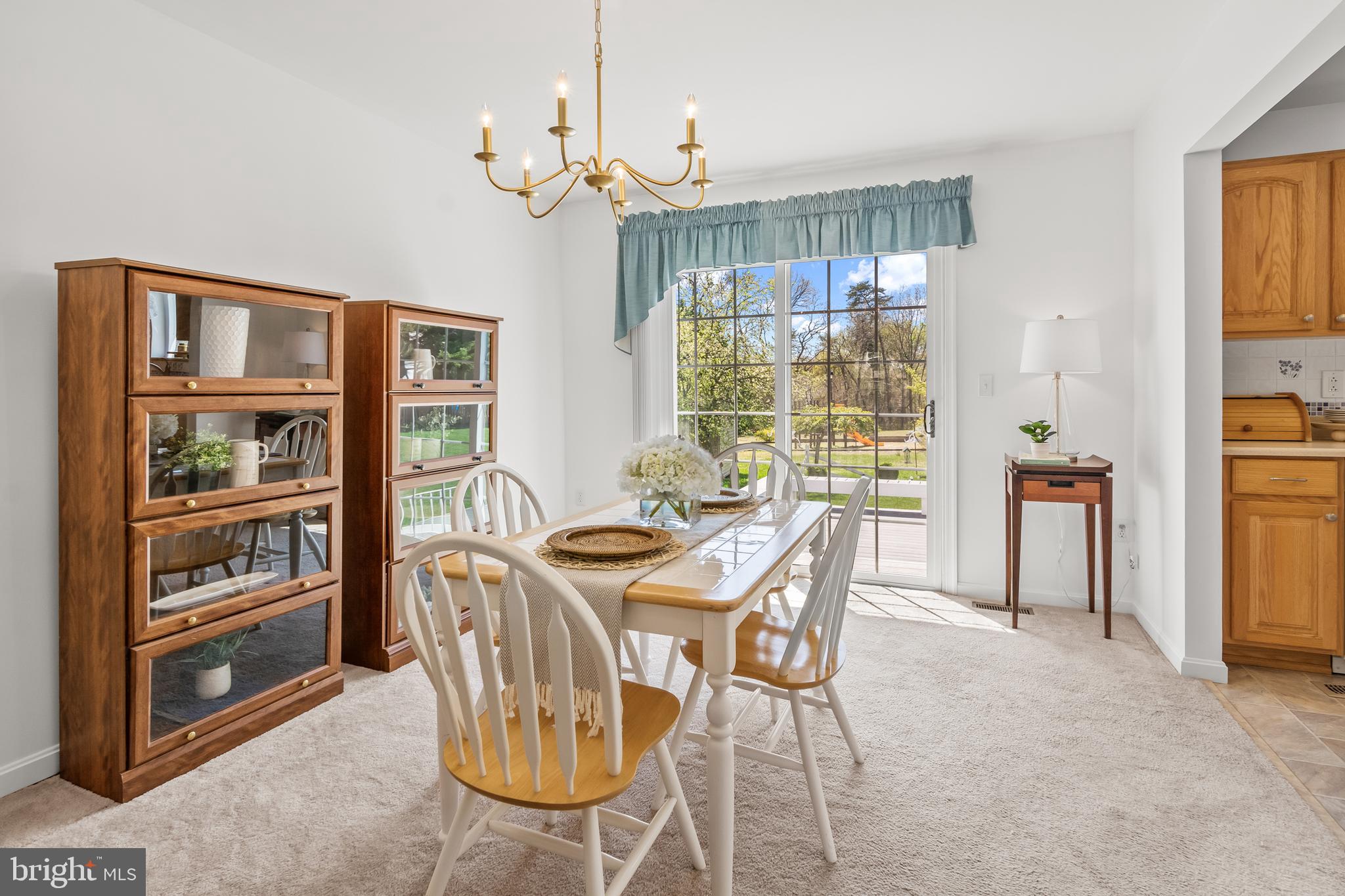 7866 Kings Bench Place Pasadena, MD 21122 - Photo 19 of 51 a view of a dining room with furniture window and outside view
