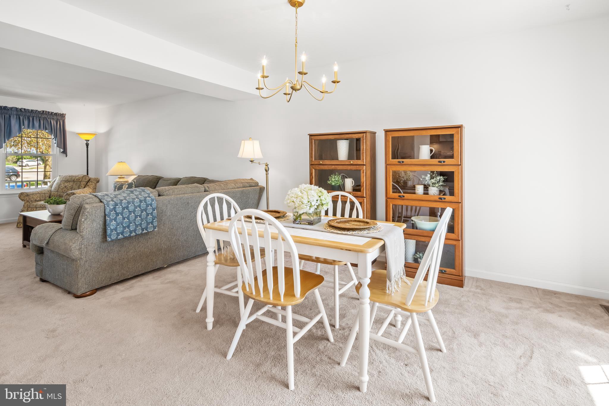 7866 Kings Bench Place Pasadena, MD 21122 - Photo 20 of 51 a dining room with furniture and chandelier