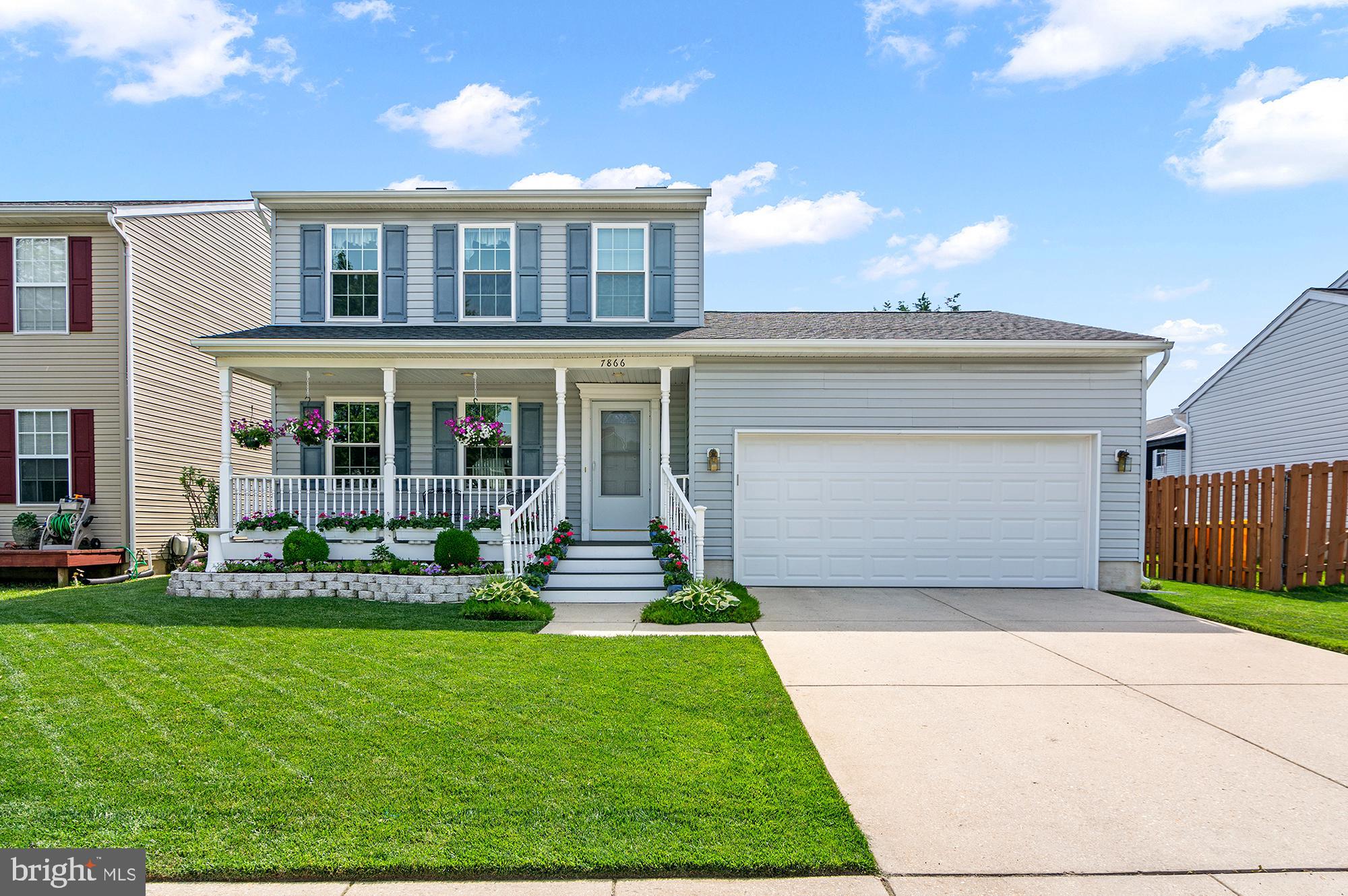7866 Kings Bench Place Pasadena, MD 21122 - Photo 2 of 51 a front view of house with yard and green space
