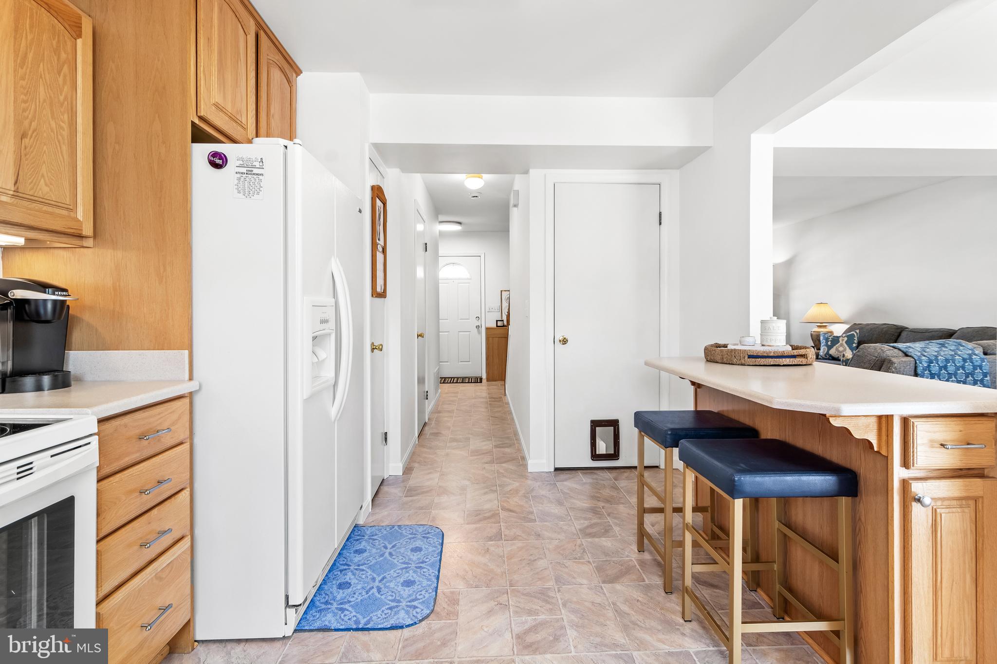 7866 Kings Bench Place Pasadena, MD 21122 - Photo 27 of 51 a kitchen with stainless steel appliances granite countertop a refrigerator and a stove top oven