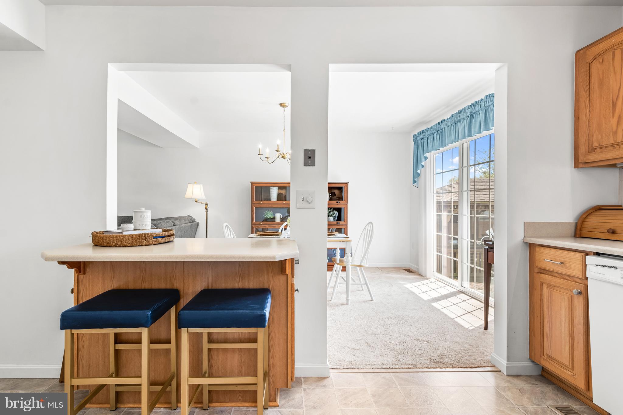 7866 Kings Bench Place Pasadena, MD 21122 - Photo 28 of 51 a view of living room with a table and chairs