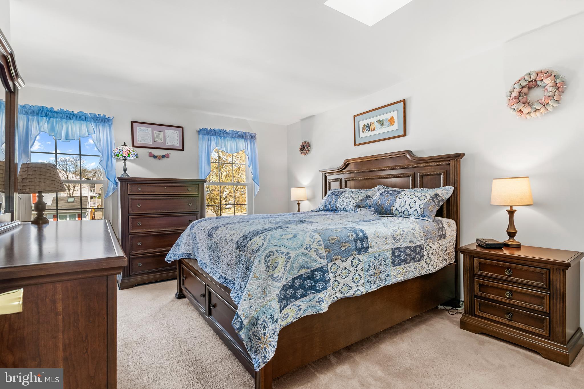 7866 Kings Bench Place Pasadena, MD 21122 - Photo 31 of 51 a bedroom with a bed and a dresser