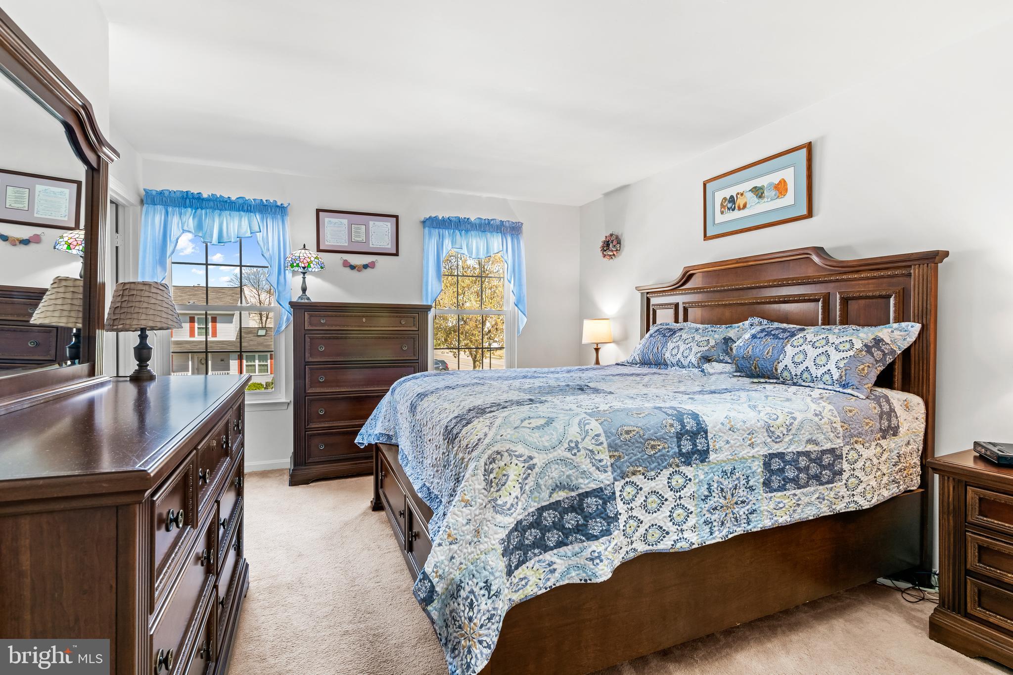 7866 Kings Bench Place Pasadena, MD 21122 - Photo 33 of 51 a bedroom with a bed and a couch