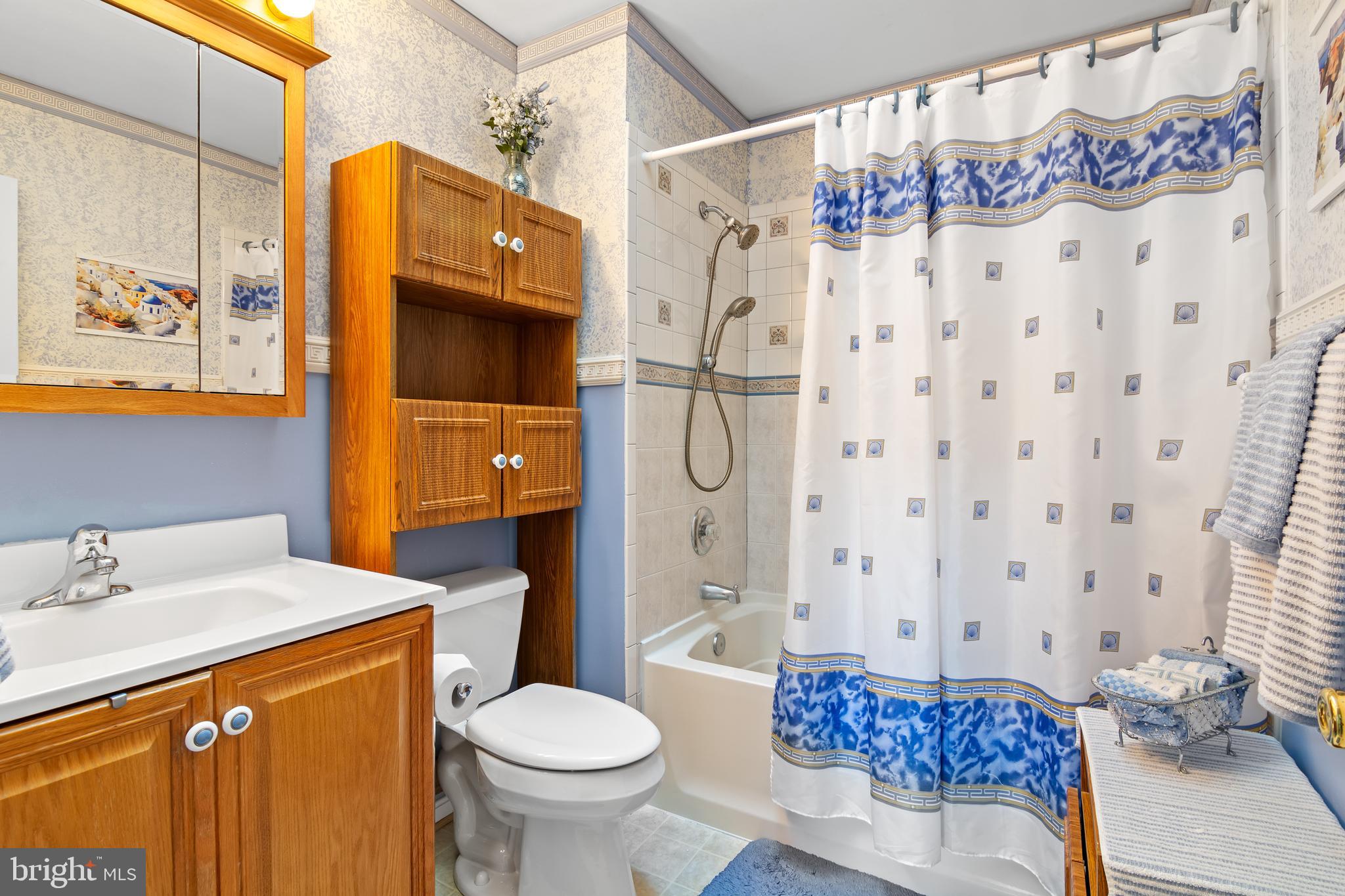 7866 Kings Bench Place Pasadena, MD 21122 - Photo 35 of 51 a bathroom with a sink toilet and shower