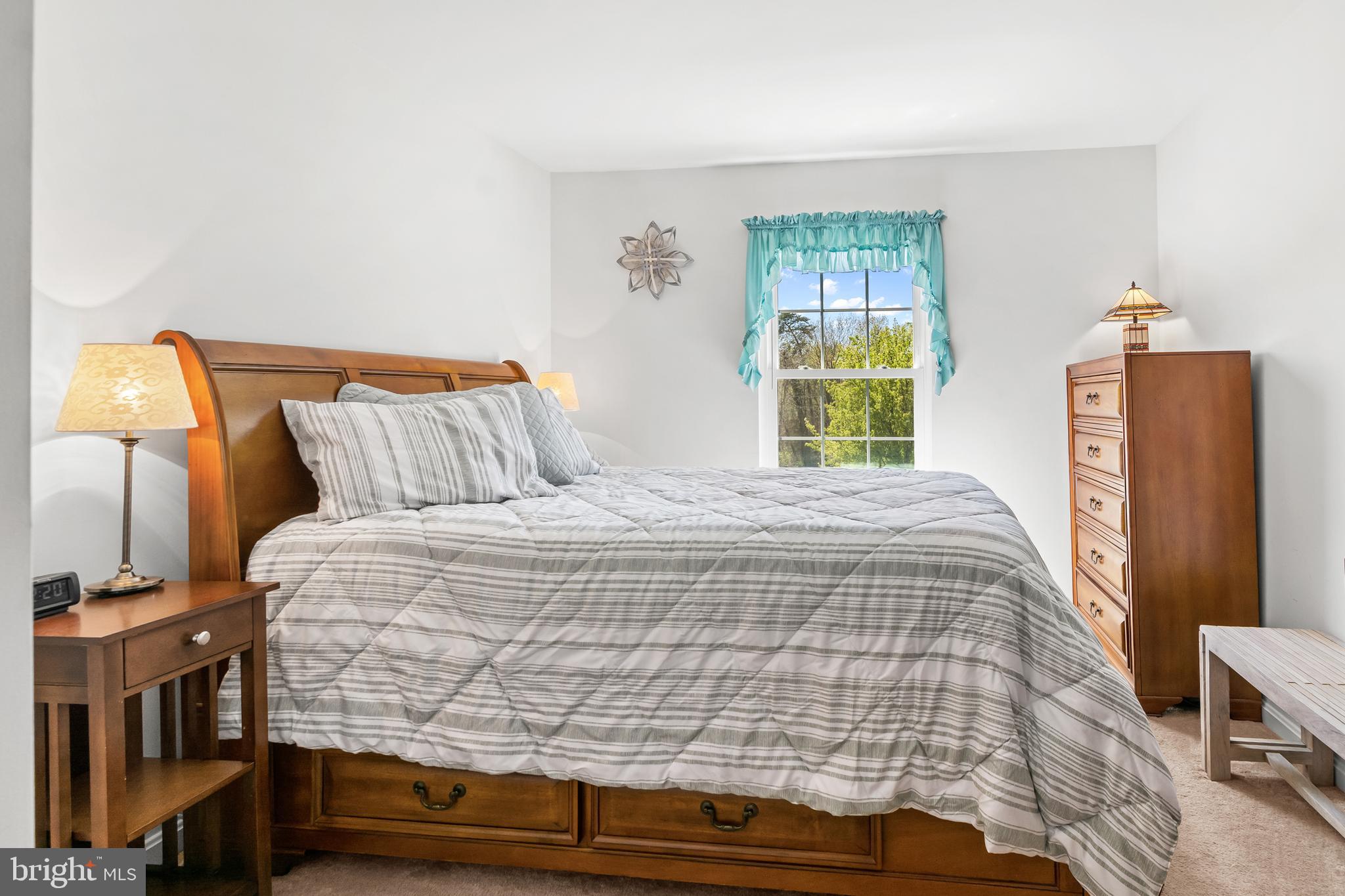 7866 Kings Bench Place Pasadena, MD 21122 - Photo 36 of 51 a bedroom with a bed and a window