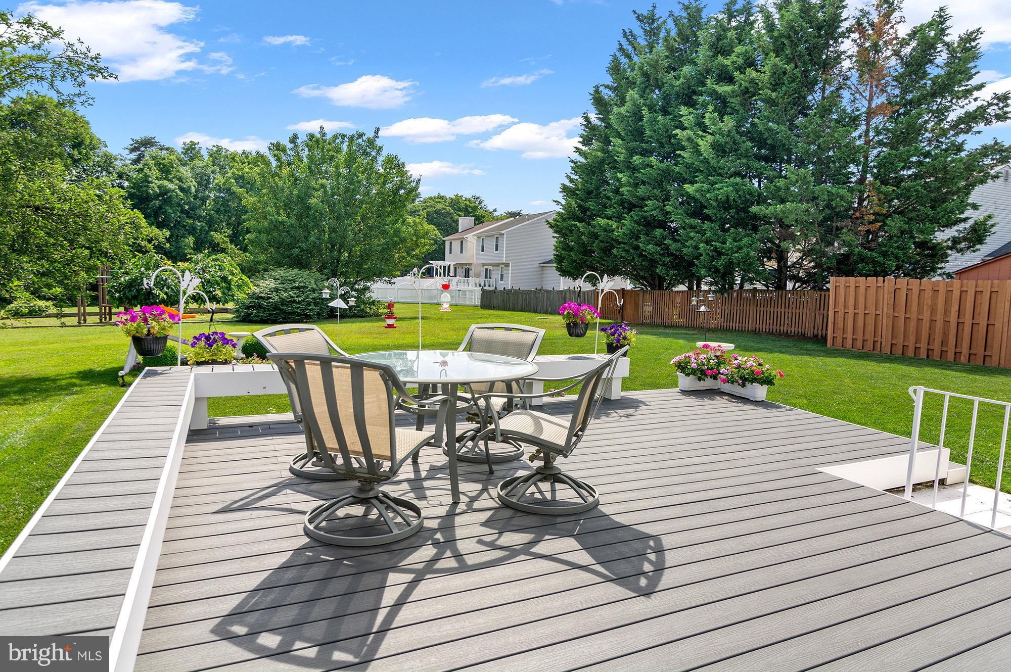7866 Kings Bench Place Pasadena, MD 21122 - Photo 9 of 51 a view of a table and chairs on the roof deck