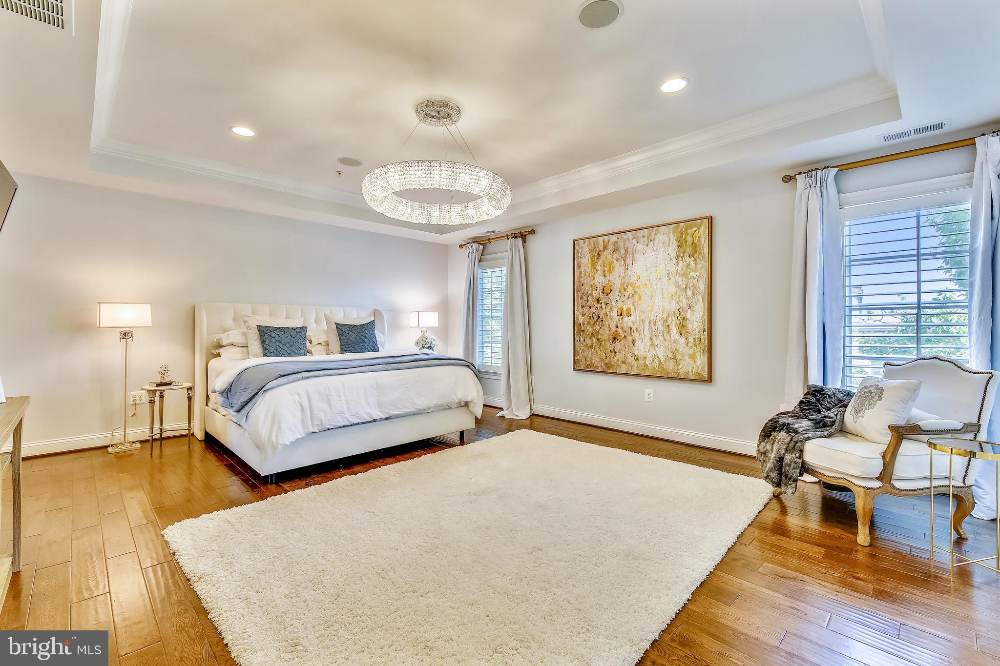 1411 Ridgeview Way Washington, DC 20007 - Photo 16 of 43 a bedroom with a bed and wooden floor
