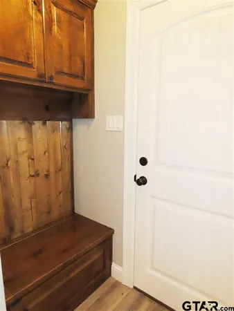 an empty room with a window and a ceiling fan