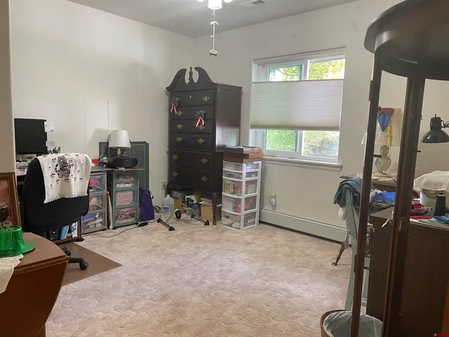 a room with furniture and a flat screen tv