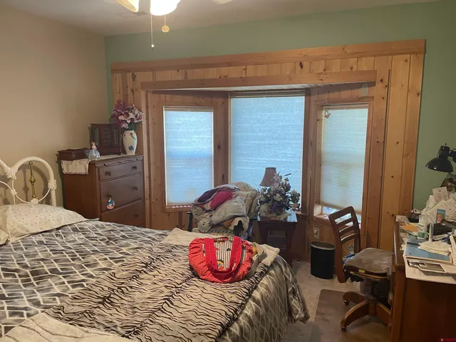 a bedroom with a bed and furniture