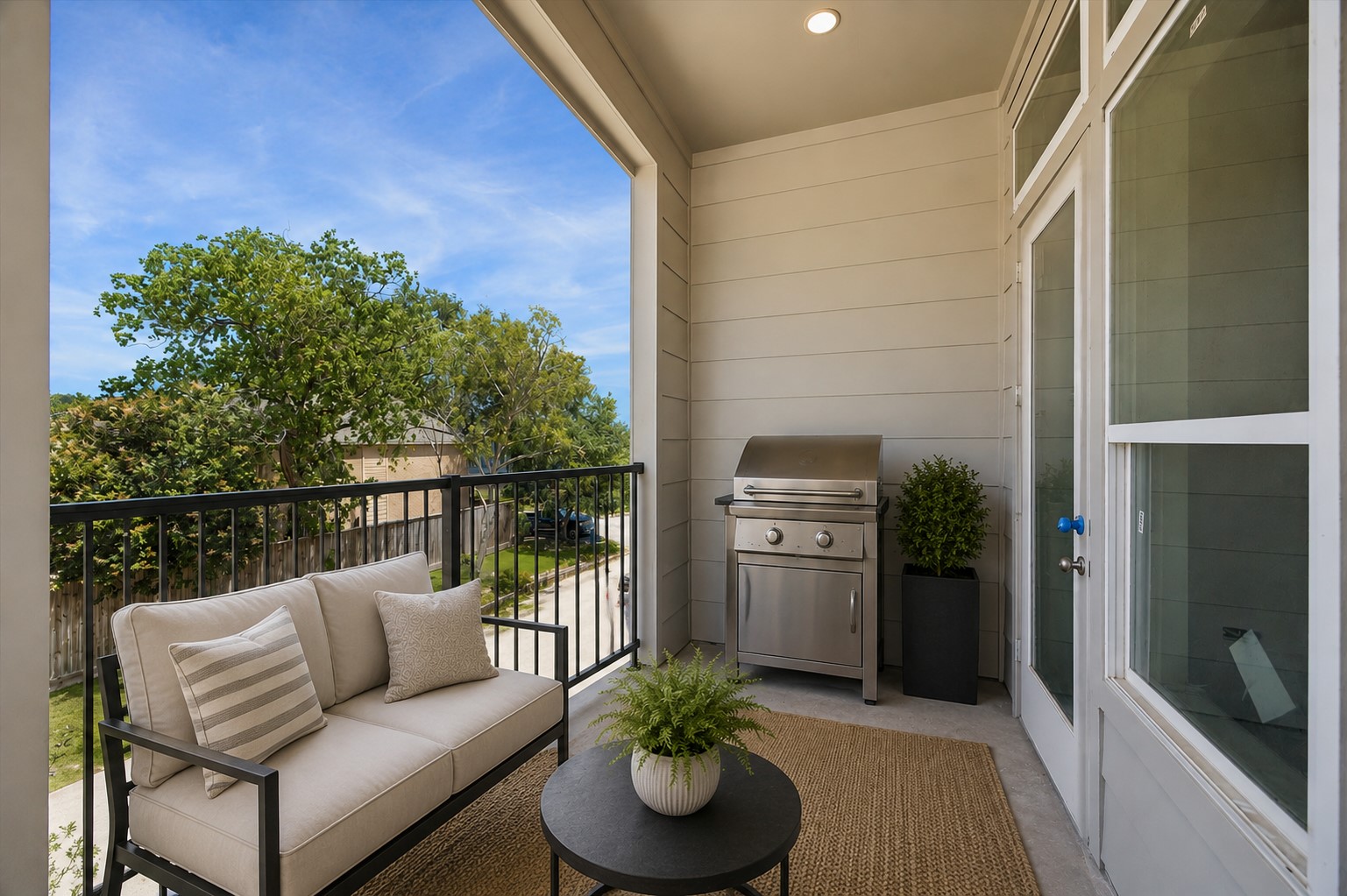 306 Fowler Street Houston, TX 77007 - Photo 12 of 29 Covered terrace complete with outdoor grilling area and cozy seating—perfect for entertaining year-round. A digitally staged image.