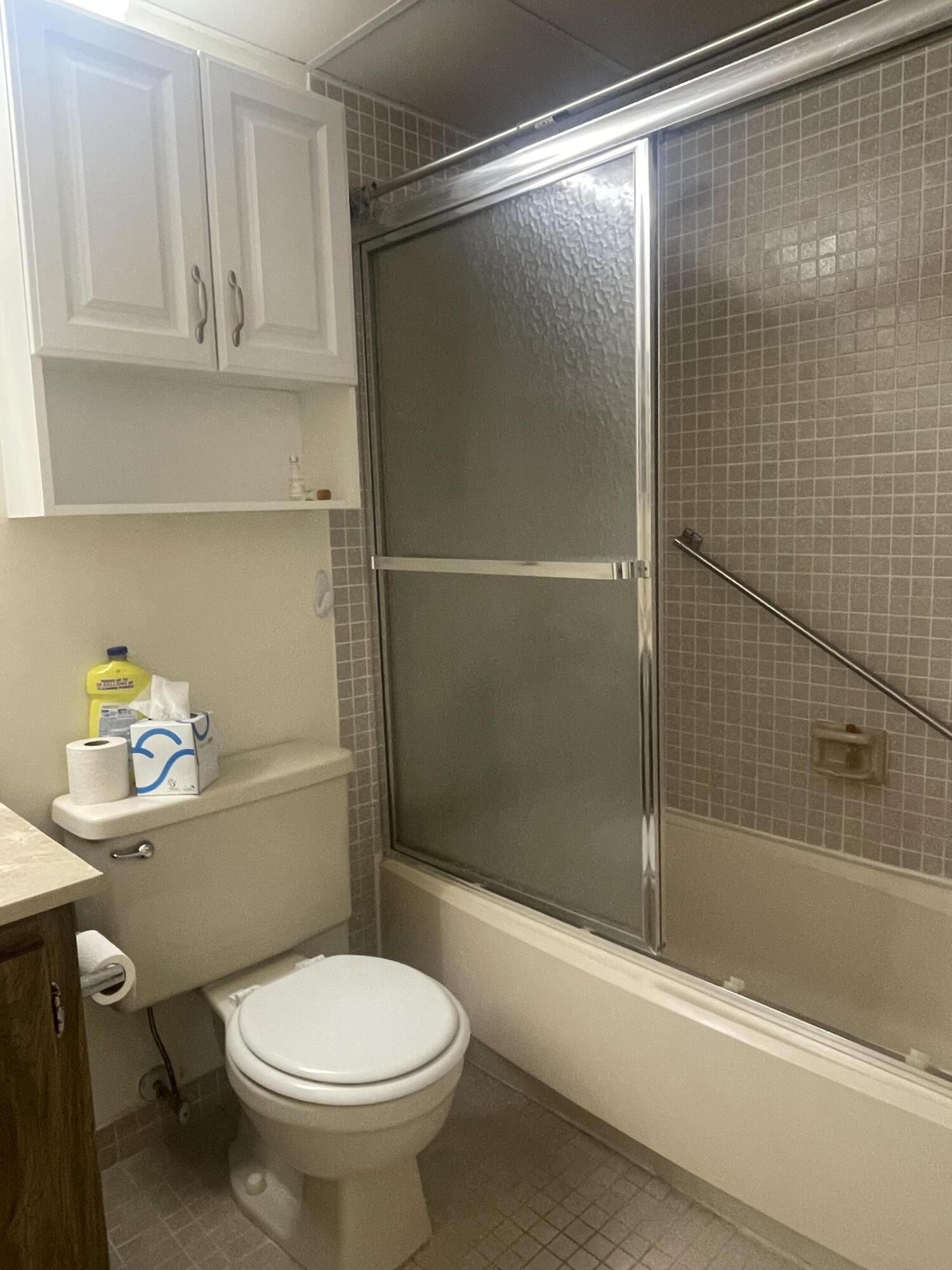 83 Capri B, Unit B Delray Beach, FL 33484 - Photo 17 of 26 a bathroom with a toilet and a shower