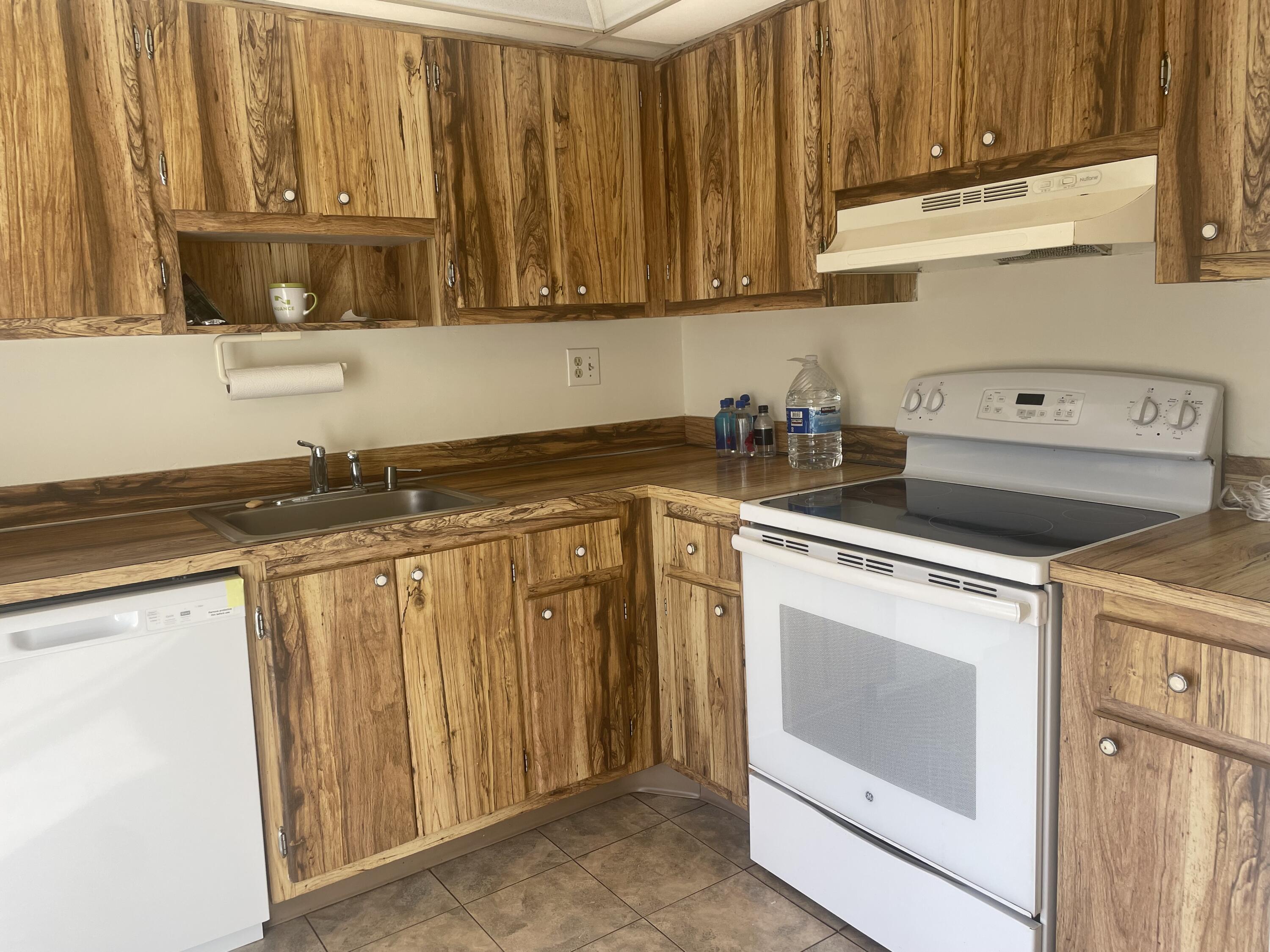 83 Capri B, Unit B Delray Beach, FL 33484 - Photo 2 of 26 a view of a kitchen with appliances