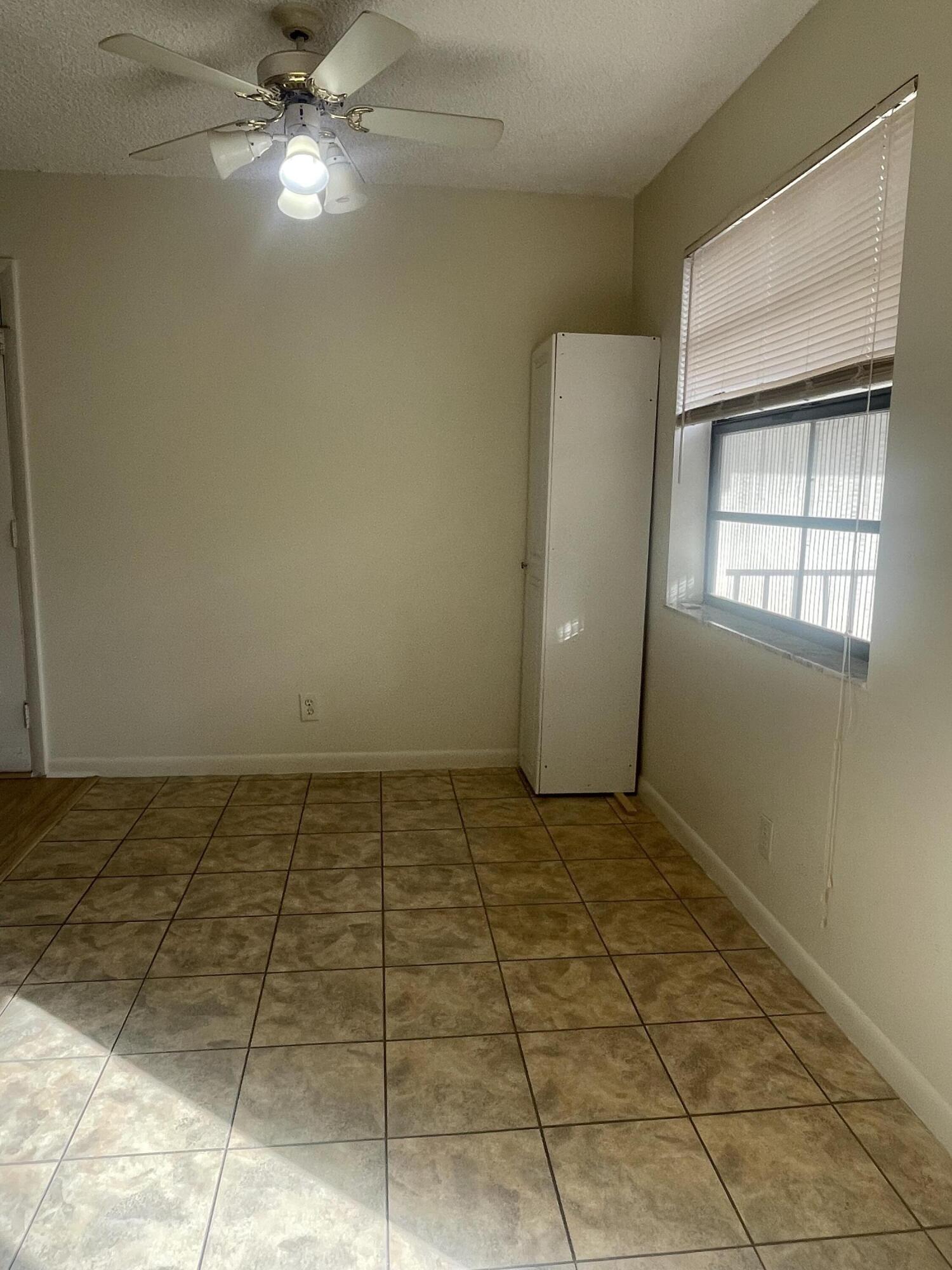 83 Capri B, Unit B Delray Beach, FL 33484 - Photo 6 of 26 a view of an empty room with a window
