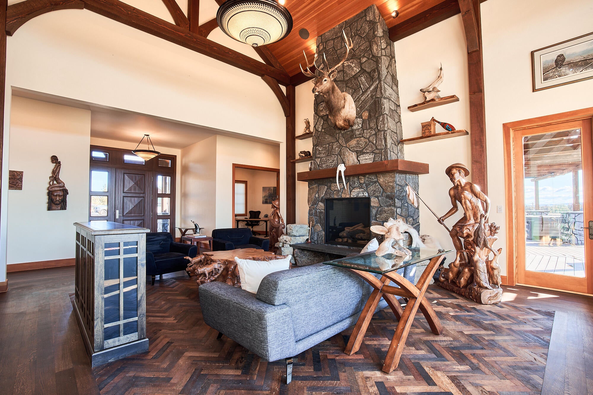 The great room with floor to ceiling stone fireplace.