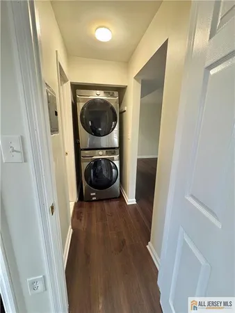 a view of a kitchen from a hallway