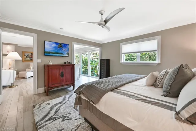 a bedroom with a large bed and a window