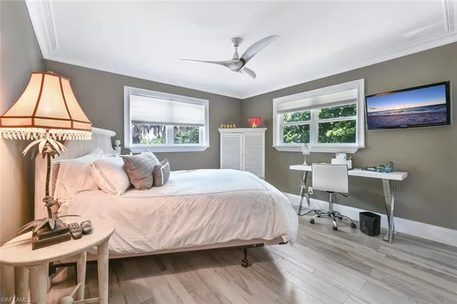 a bedroom with a bed and a table