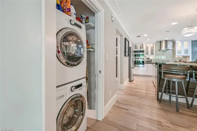 a view of a hallway with washer and dryer