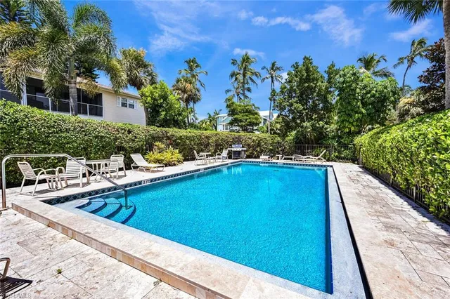 a view of swimming pool with seating area
