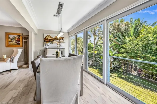 a view of living room with furniture and a large window