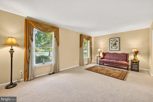 a dining room with furniture window and outside view