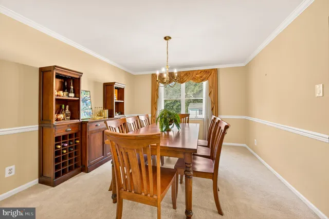 a large kitchen with stainless steel appliances granite countertop a sink and cabinets