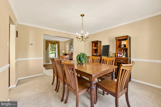a kitchen with granite countertop wooden cabinets stainless steel appliances a sink and a window