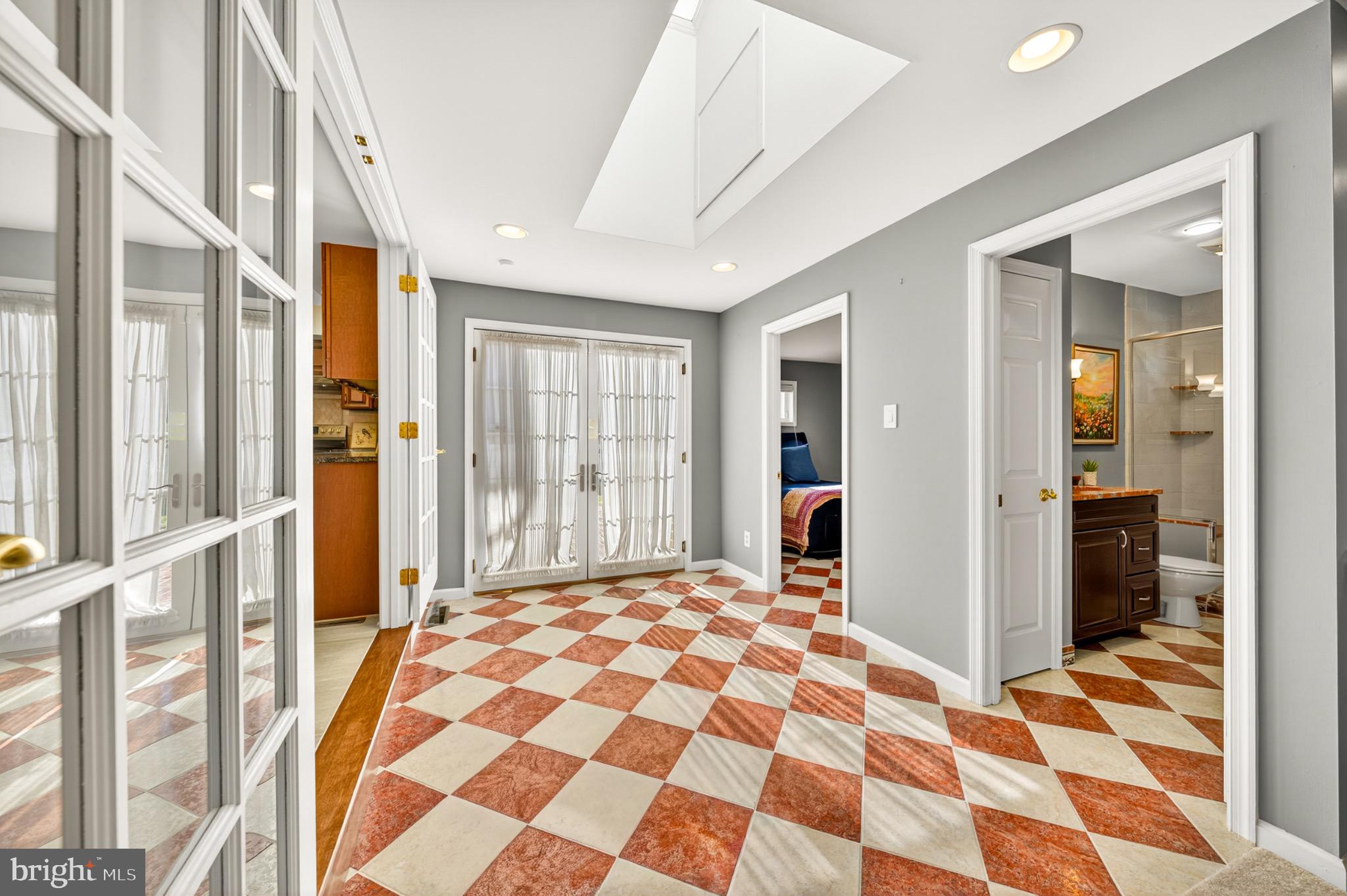 1520 Fairgrounds Road Hatfield, PA 19440 - Photo 26 of 52 a bedroom with a bed and a walk in closet with wooden floor