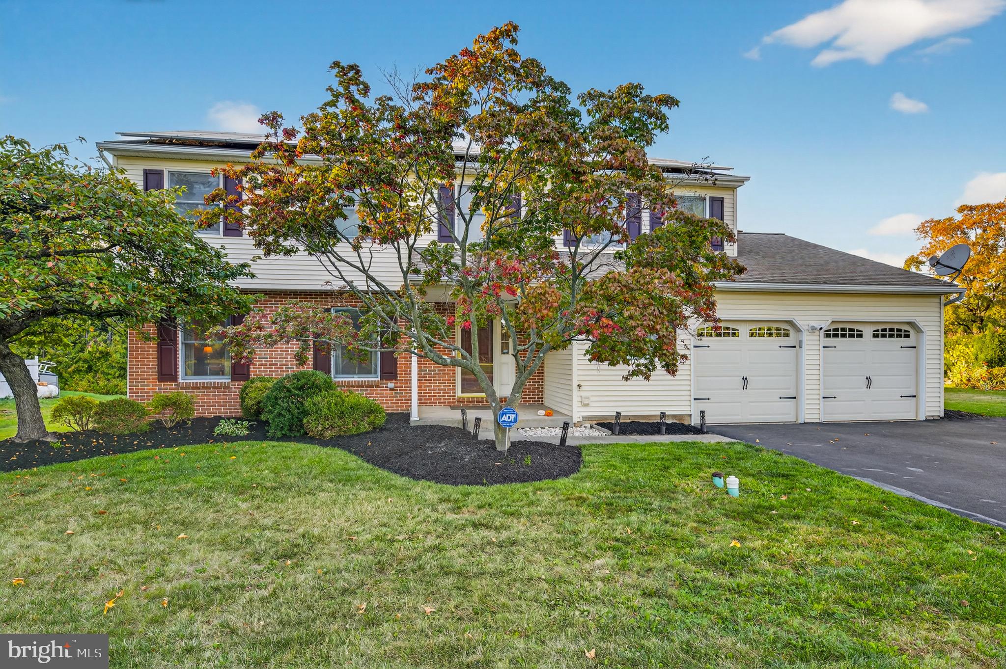 1520 Fairgrounds Road Hatfield, PA 19440 - Photo 3 of 52 a front view of a house with a yard and garage