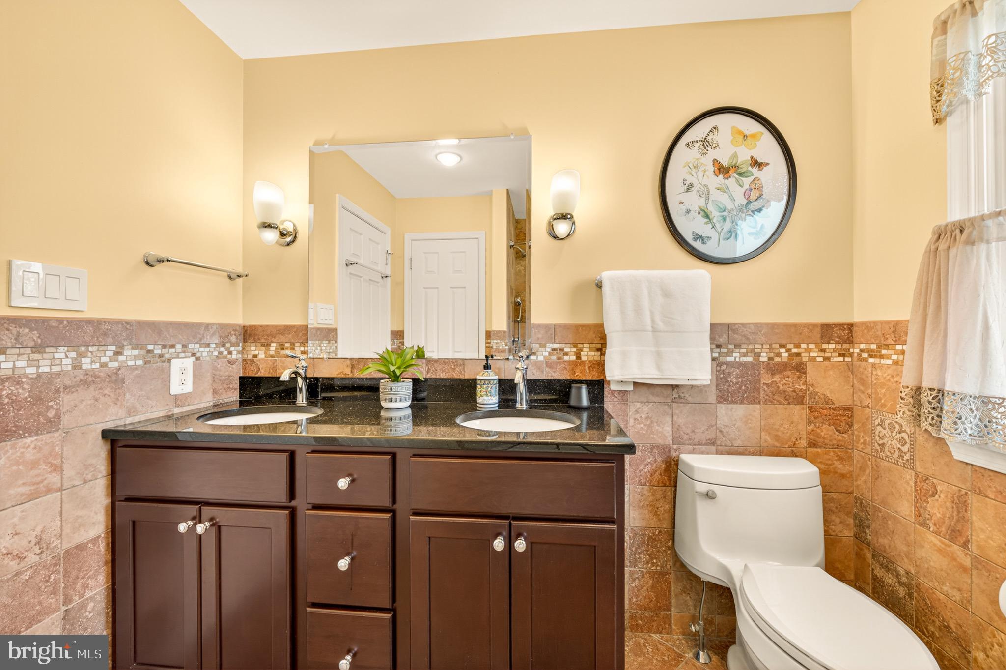 1520 Fairgrounds Road Hatfield, PA 19440 - Photo 33 of 52 a bathroom with a toilet a sink and a mirror