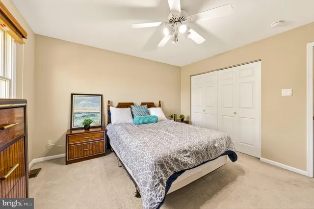 a spacious bedroom with a bed and window
