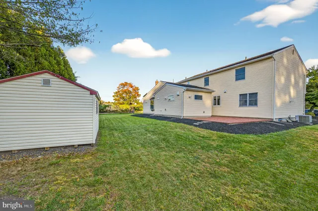 a view of a backyard of the house
