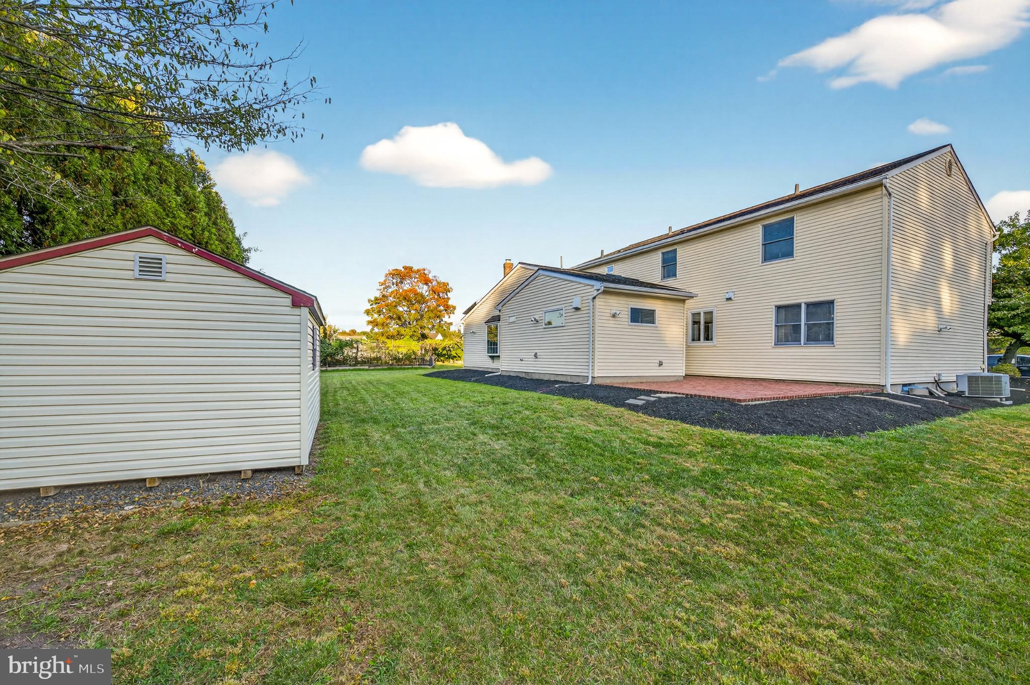 1520 Fairgrounds Road Hatfield, PA 19440 - Photo 46 of 52 a view of a backyard with plants and a garden