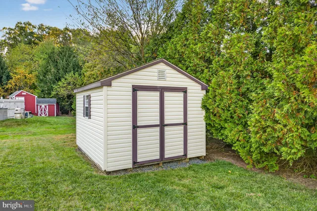 an aerial view of a house with garden space lake view and mountain view