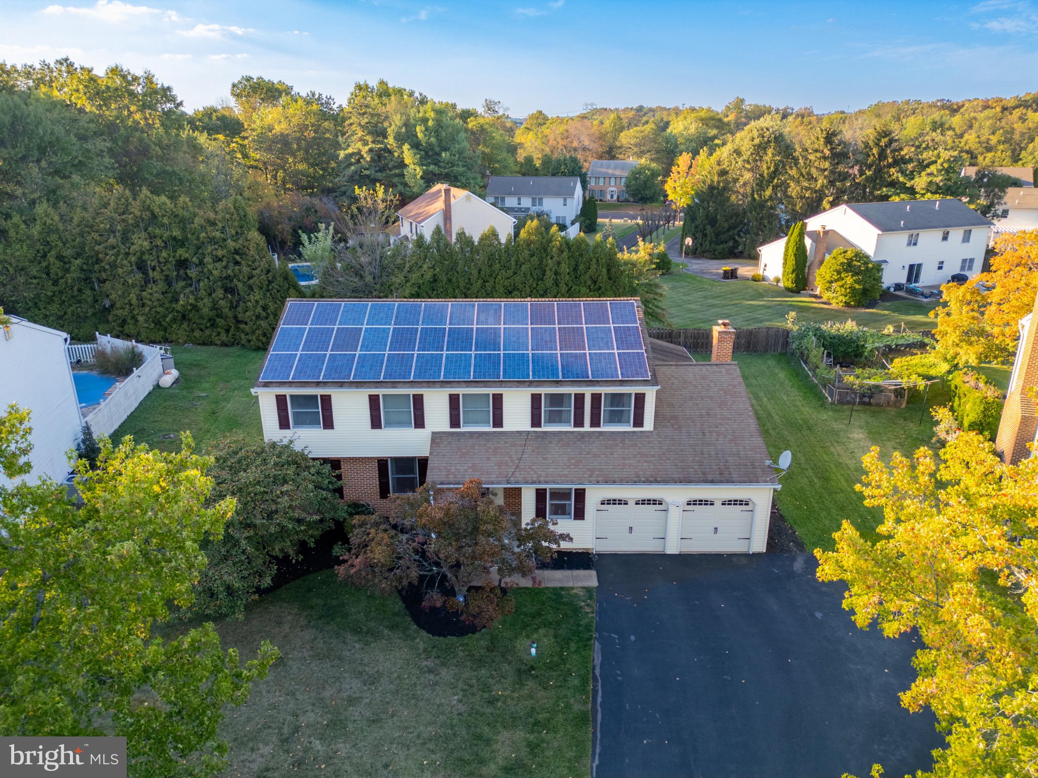 1520 Fairgrounds Road Hatfield, PA 19440 - Photo 5 of 52 an aerial view of a house with table and chairs under an umbrella