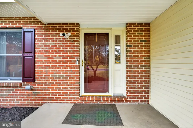 a spacious bedroom with a bed and glass door