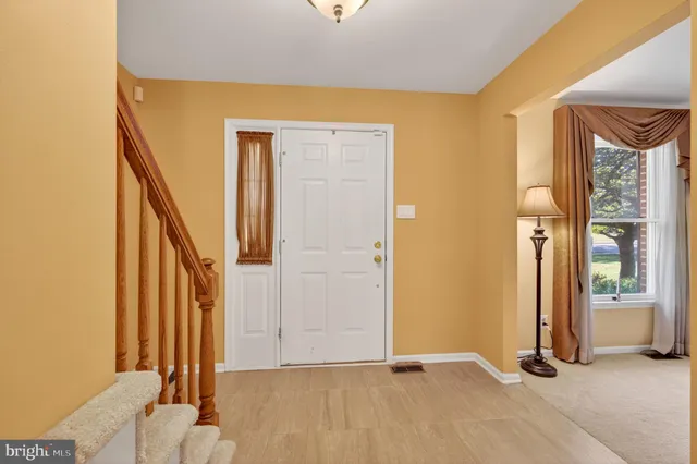 a view of a livingroom with furniture and a window