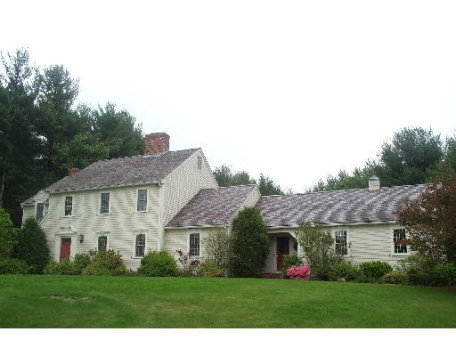 27 Vaughn Hill Road Bolton, MA 01740 - Photo 1 of 1 a front view of house with yard and green space