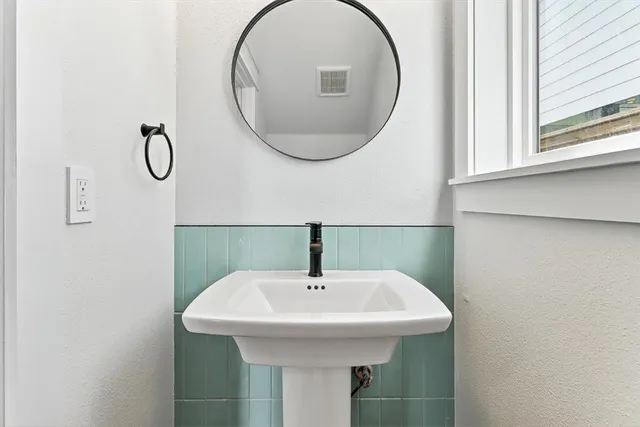 a view of storage and utility room with a window