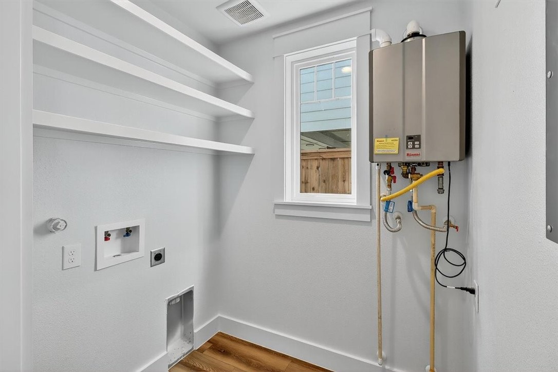 232 Nautilus Port Aransas, TX 78373 - Photo 15 of 28 a view of storage and utility room with a window