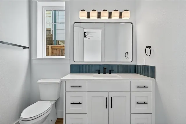 a view of a room with wooden floor and a window