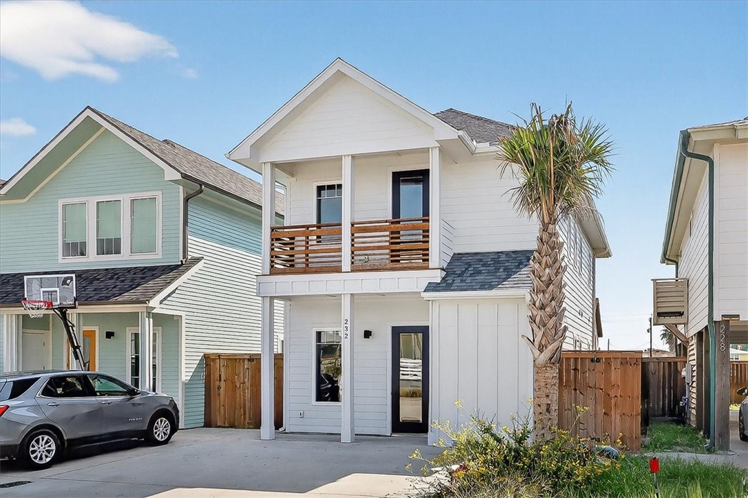232 Nautilus Port Aransas, TX 78373 - Photo 28 of 28 a front view of a house with a yard and garage
