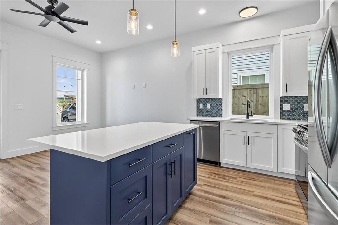 232 Nautilus Port Aransas, TX 78373 - Photo 10 of 28 a kitchen with a sink stove and cabinets