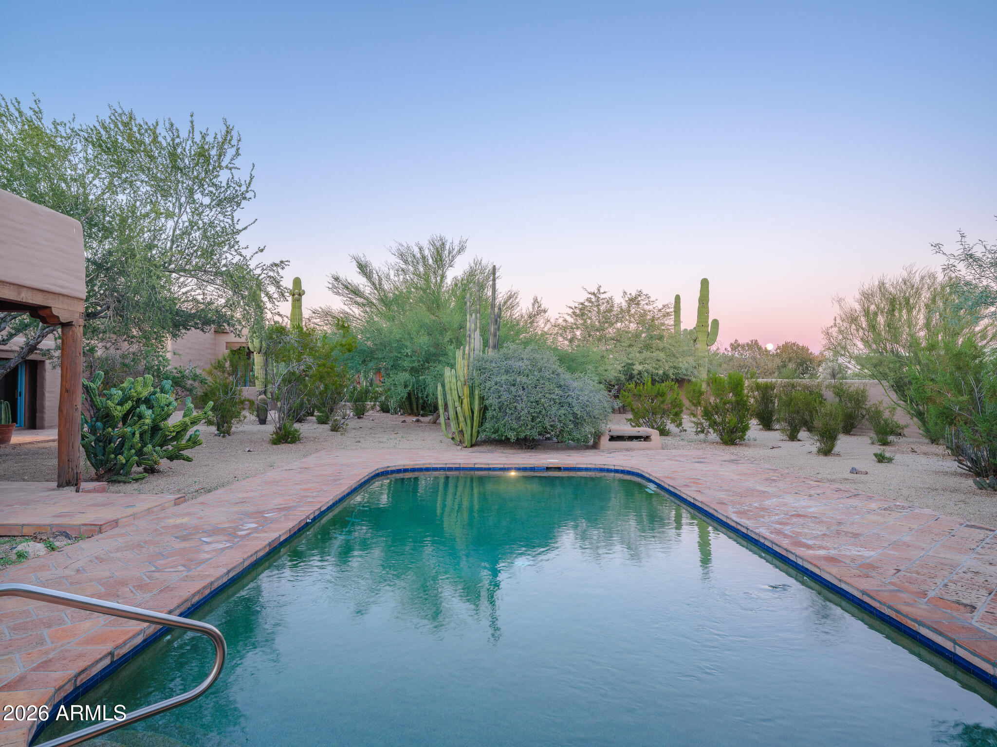 5507 North Palo Cristi Road Paradise Valley, AZ 85253 - Photo 26 of 41 a swimming pool with trees in the background