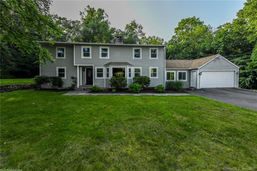 14 Pinnacle Road Farmington, CT 06032 - Photo 1 of 1 a front view of house with yard and green space