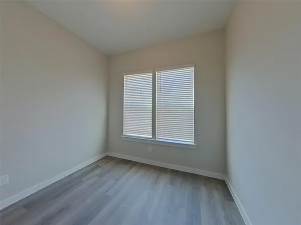 wooden floor and window in an empty room
