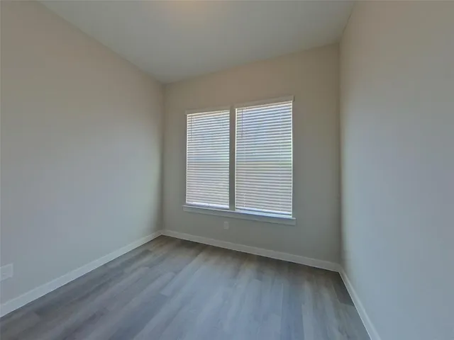 wooden floor and window in an empty room