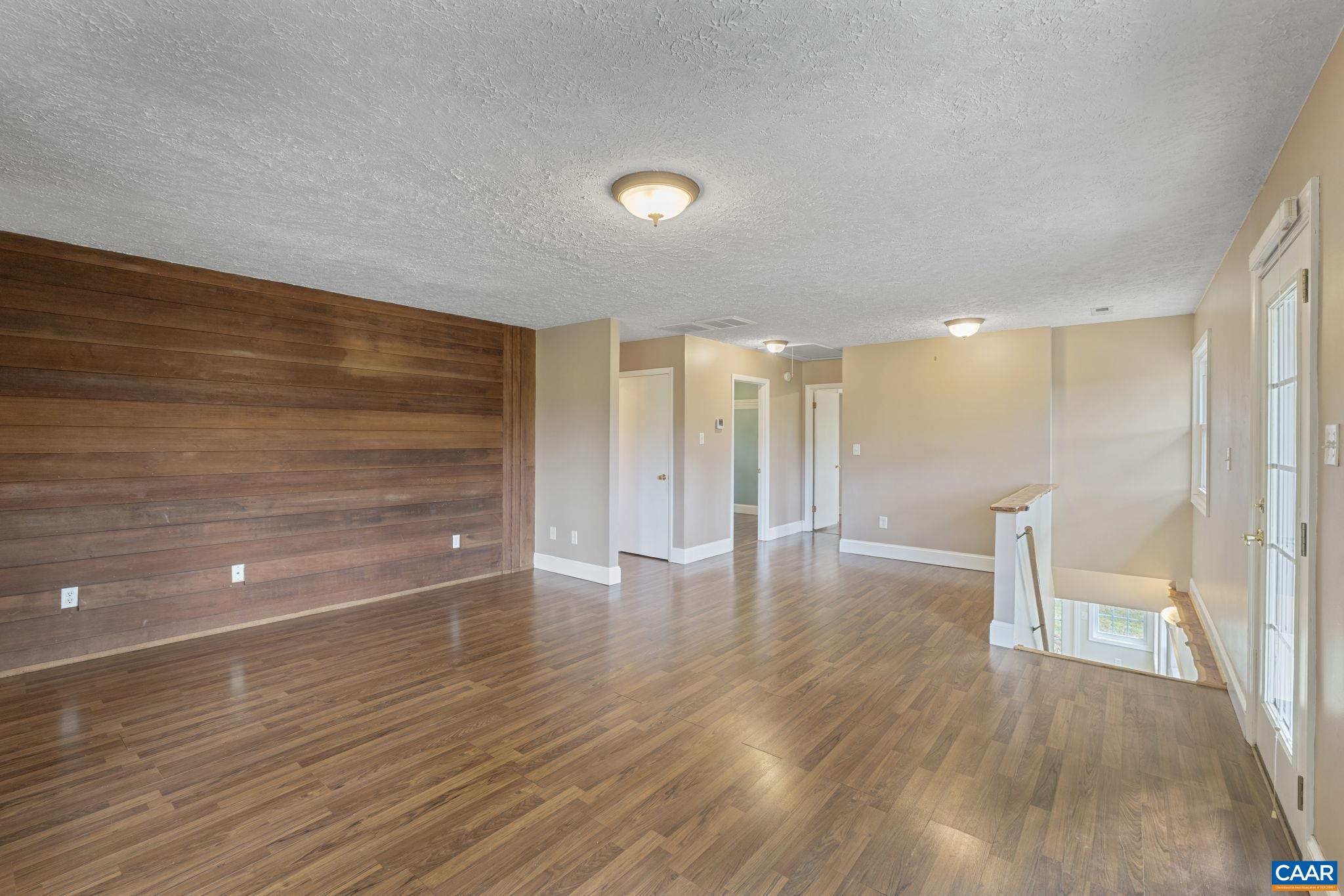8508 Dick Woods Road Afton, VA 22920 - Photo 11 of 55 a view of empty room with wooden floor