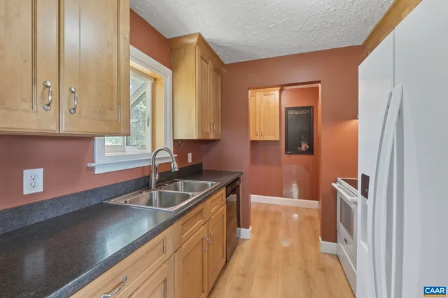 a kitchen with a sink and a window